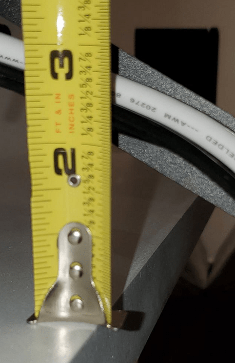 The MantelMount arm at its lowest position, about 2" above the front edge of the mantel.